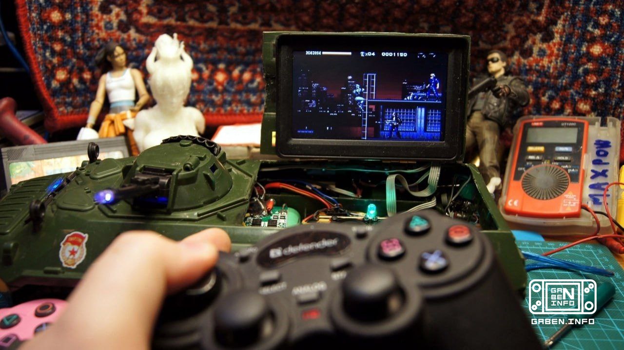 A retro gaming harvester assembled in the body of a toy armored personnel carrier.