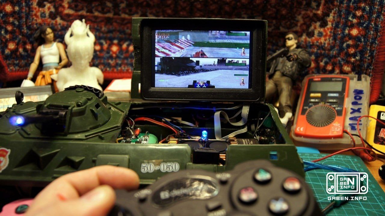 A retro gaming harvester assembled in the body of a toy armored personnel carrier.